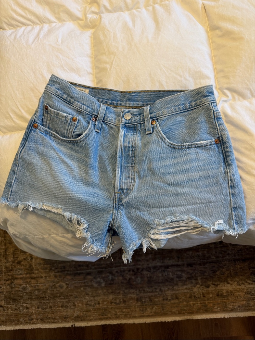 Levi's Light Blue Distressed Denim Cutoff Shorts - size 28